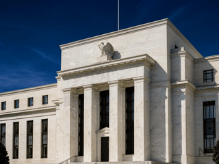 Warsh Vows the Fed Will Deliver Price Stability as Rate Hold Draws Two Dissents